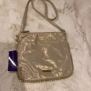 Madden girl.Gold shimmery with chain crossbody pur